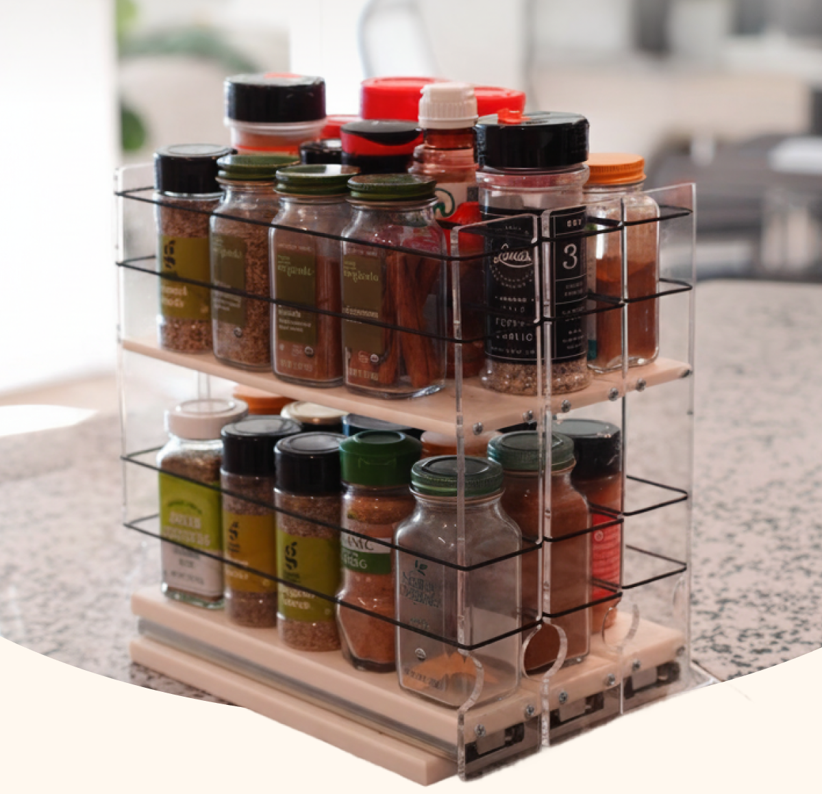 Vertical spice rack drawer organizer filled with spice jars, displayed on a kitchen countertop to show vertical storage.