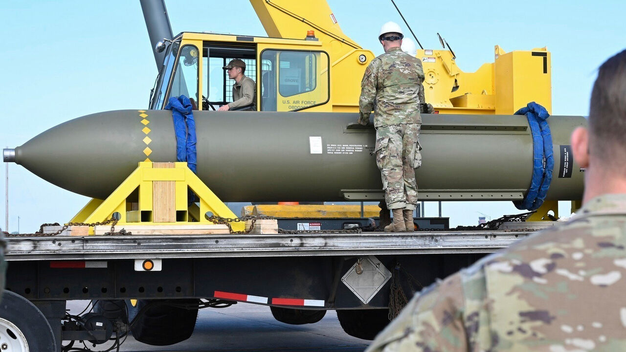 Airmen look at a GBU-57, or the Massive Ordnance Penetrator bomb, at Whiteman Air Base in Missouri, USA.