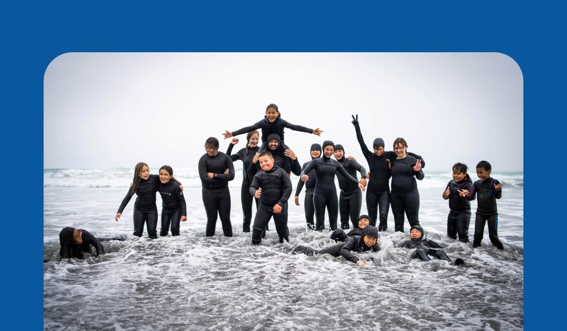 Group photo of kids&nbsp;at the beach.