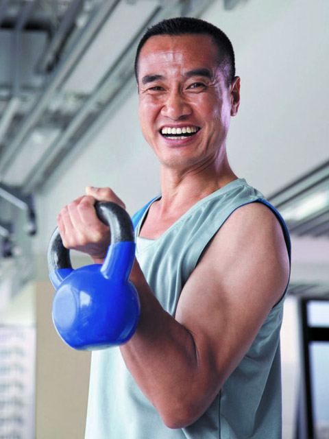 man working out with hand weights