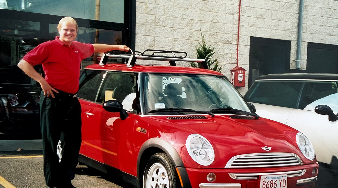 Brig Currie next to a red MINI