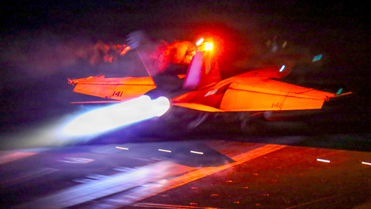 An F/A-18F Super Hornet, attached to Strike Fighter Squadron (VFA) 41, launches from the flight deck of Nimitz-class aircraft carrier USS Abraham Lincoln