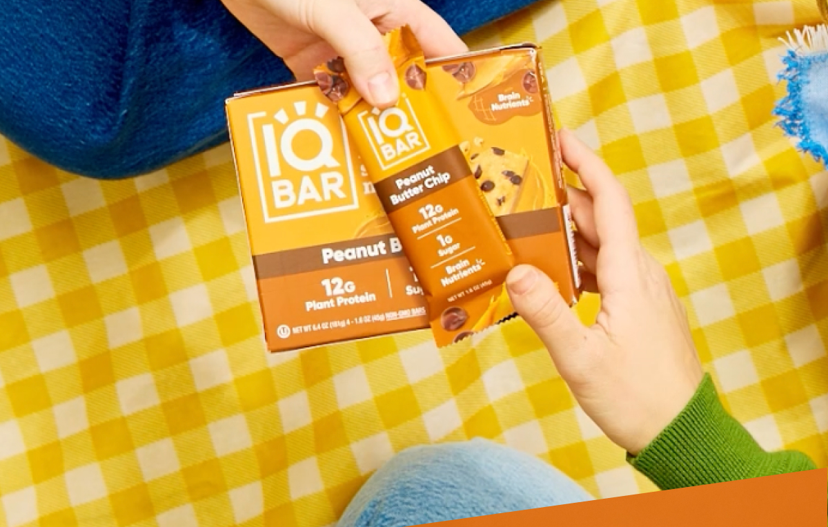 an image of a person holding a box of peanut butter bars