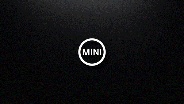 Silouette of MINI shown through organic materials such as water, plants, sand, and red light. 