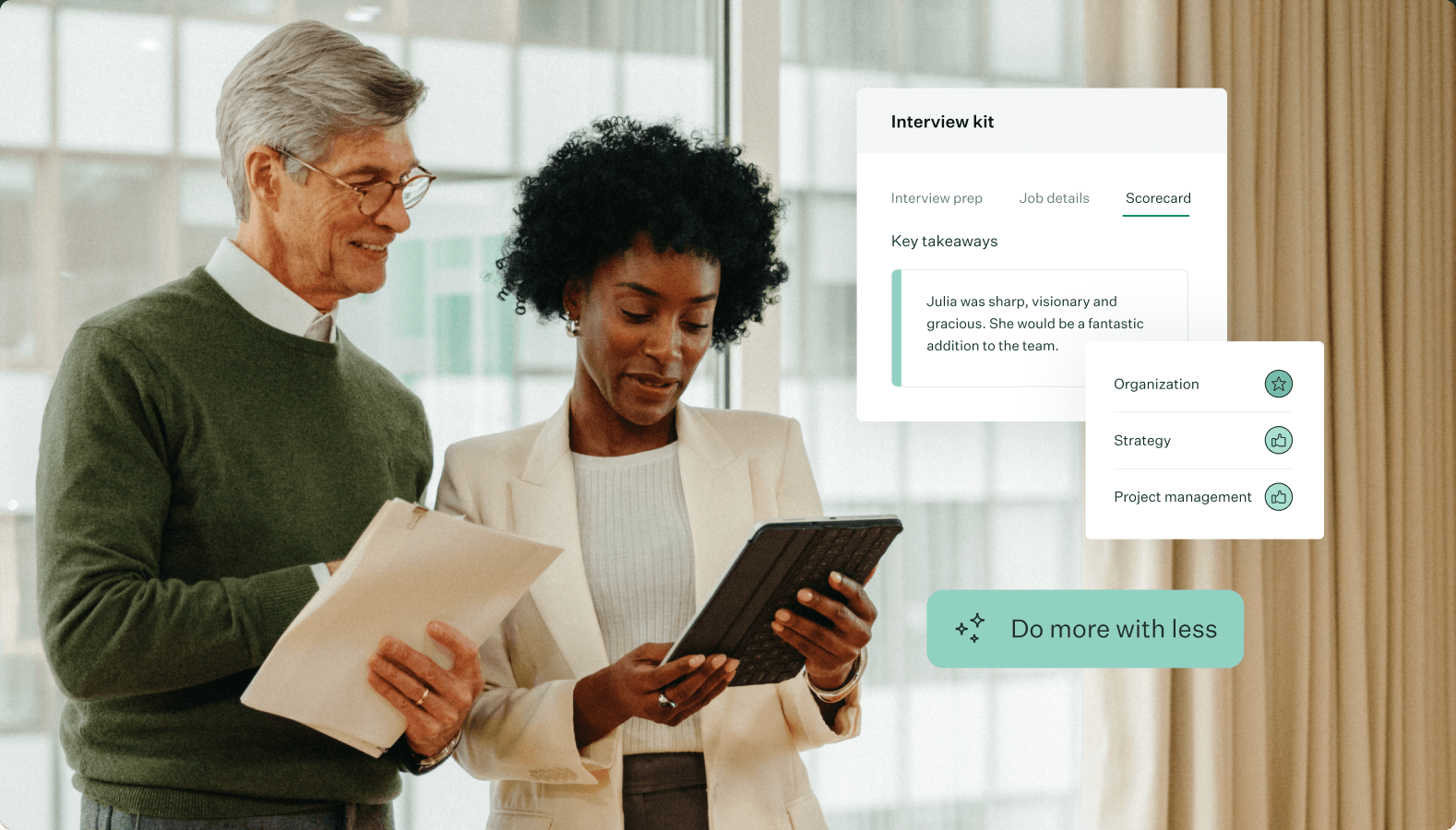 Image-of-two-coworkers-talking-over-tablet-with-do-more-with-less-pill-and-interview-kit-scorecard-UI