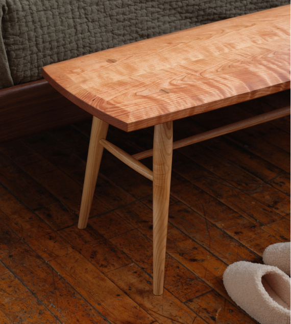 Corner view of the Freeport Bench in cherry