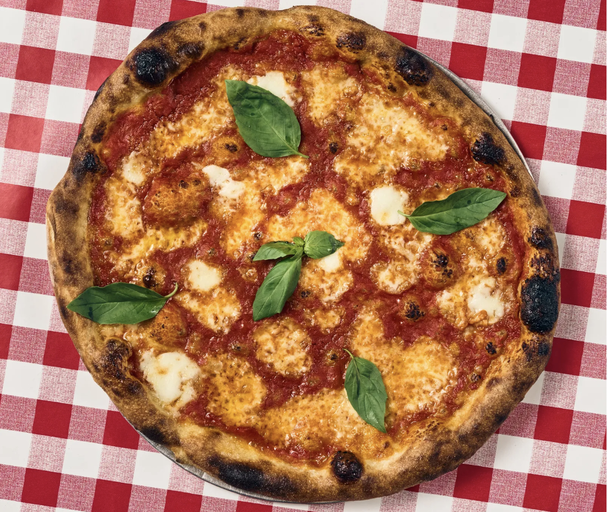pizza on red-check tablecloth