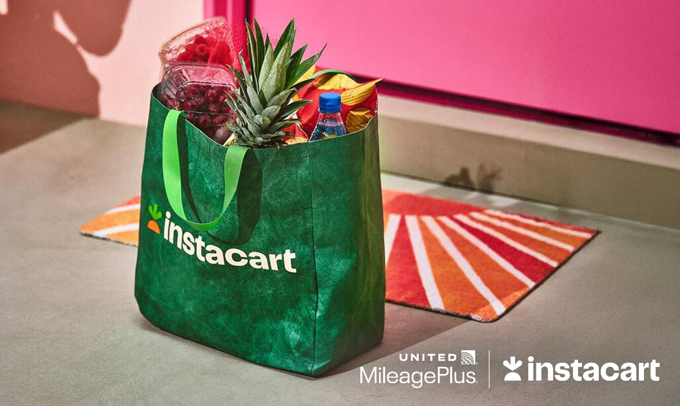 A green Instacart bag sits by a colorful door. United MileagePlus logo. Instacart logo.