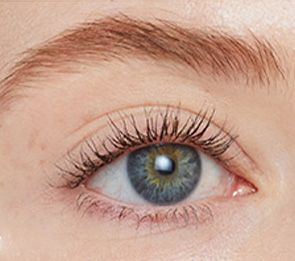 Woman wearing Jane Iredale mascara with beautiful, long lashes