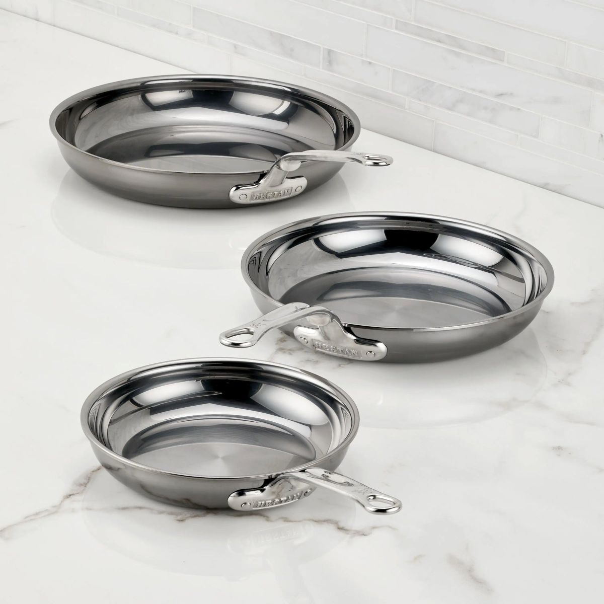 IMG: NanoBond® Titanium Skillets on marble countertop