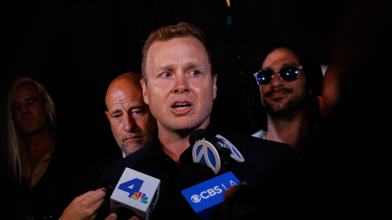 Spencer Platt speaks into microphones.