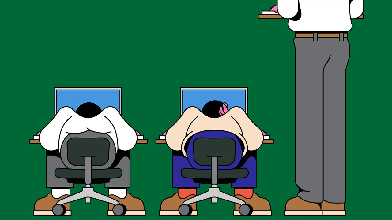 A person sat at their desk, looking up at a very tall person standing at their desk