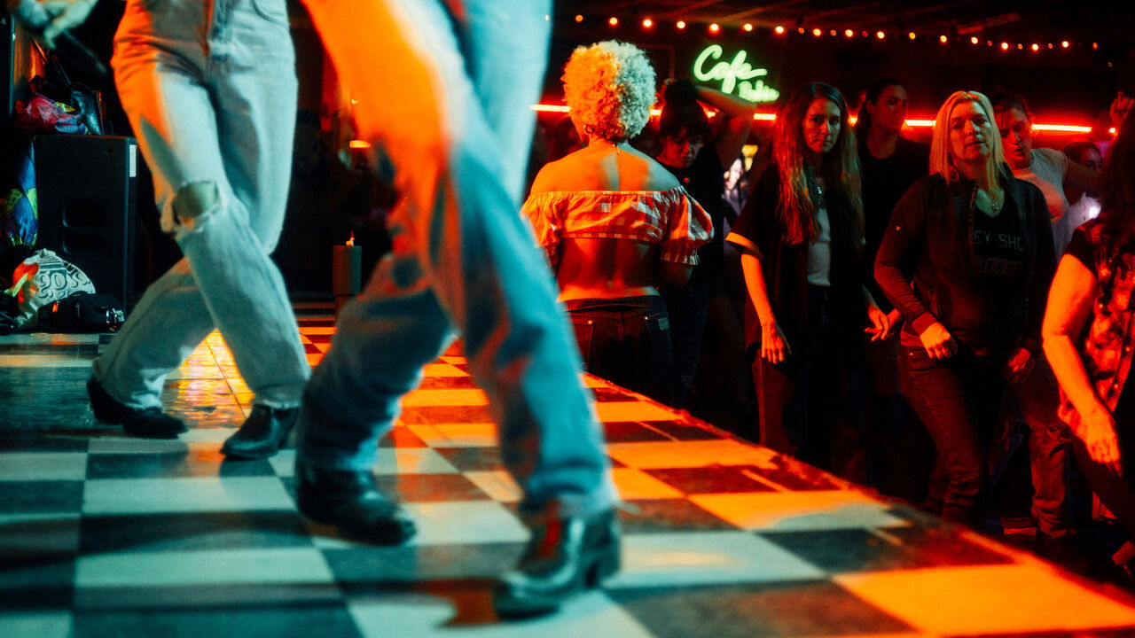 People partake in line dancing at Stud Country.