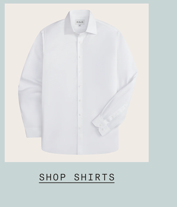 Flat lay of a white long-sleeve dress shirt with a spread collar and button cuffs, featuring The Black Tux branding on the collar. Text: "SHOP SHIRTS"