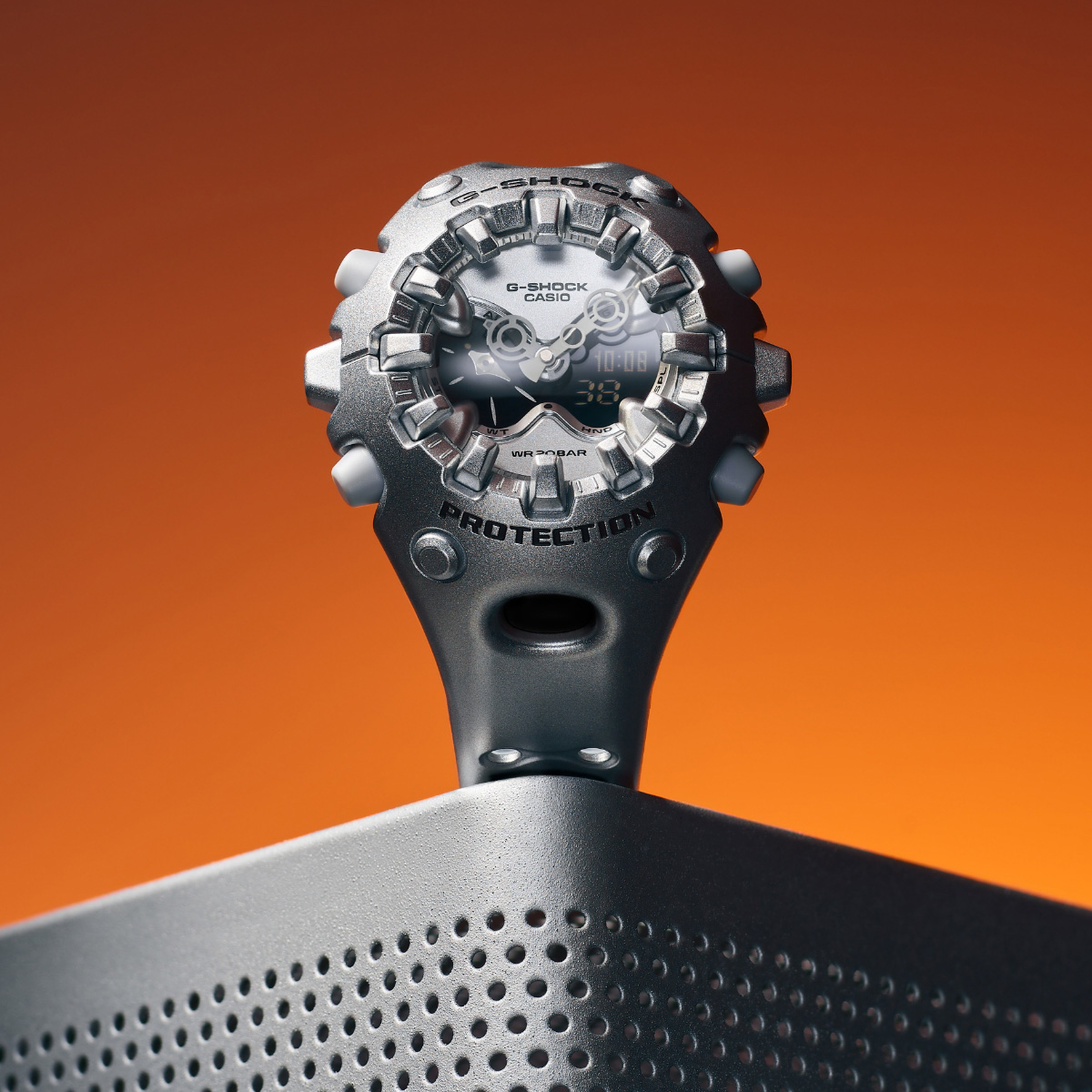 grey watch on an orange background