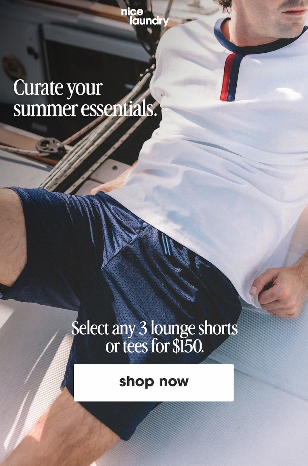 Man sitting on boat wearing white vintage ringer tee and navy blue lounge shorts. Text overlay says curate your summer essentials, select any 3 lounge shorts or tees for $150