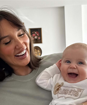 Celebrity Megan McKenna smiling with her little boy Landon