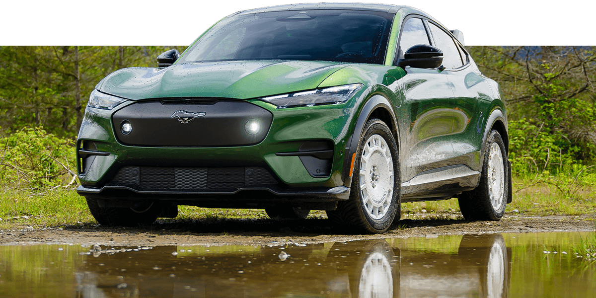 A Ford Mustang Mach‑E&reg; SUV parked on a dirt road