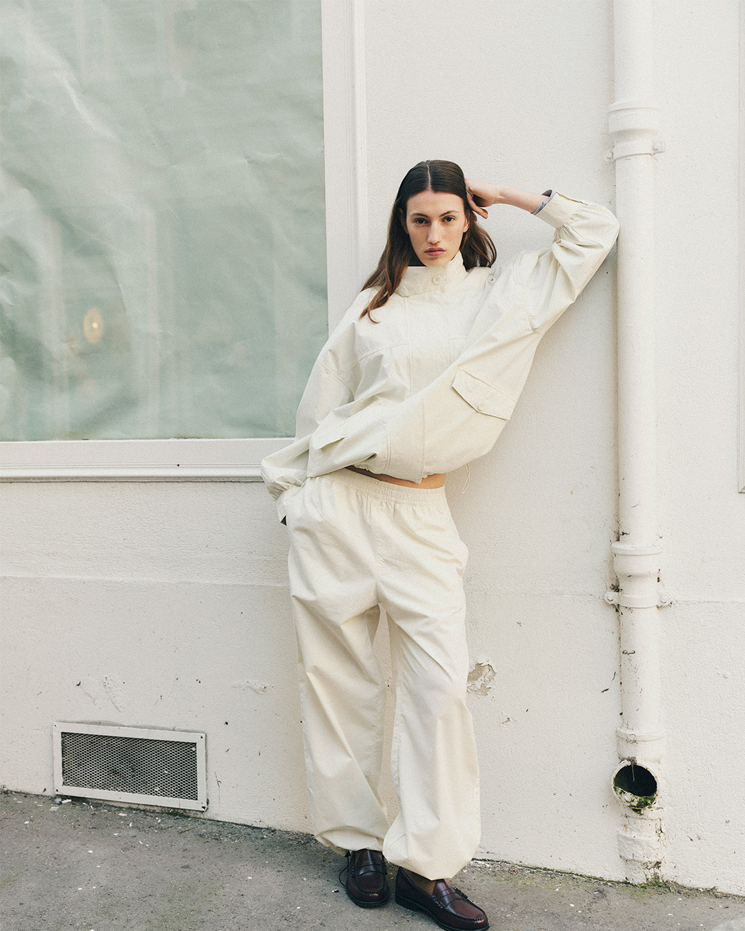 Girl in cream jacket and pants