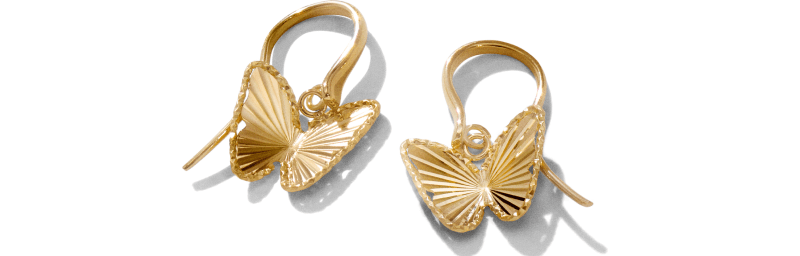 Pair of yellow gold butterfly drop earrings with textured wings.