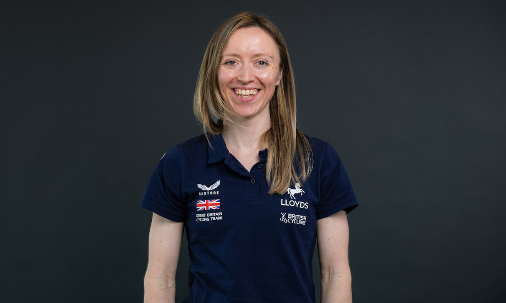 A profile image of Anna Morris wearing a casual team T-shirt against a dark background.