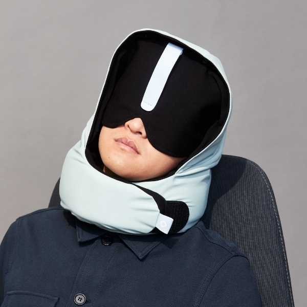a person with a neck pillow