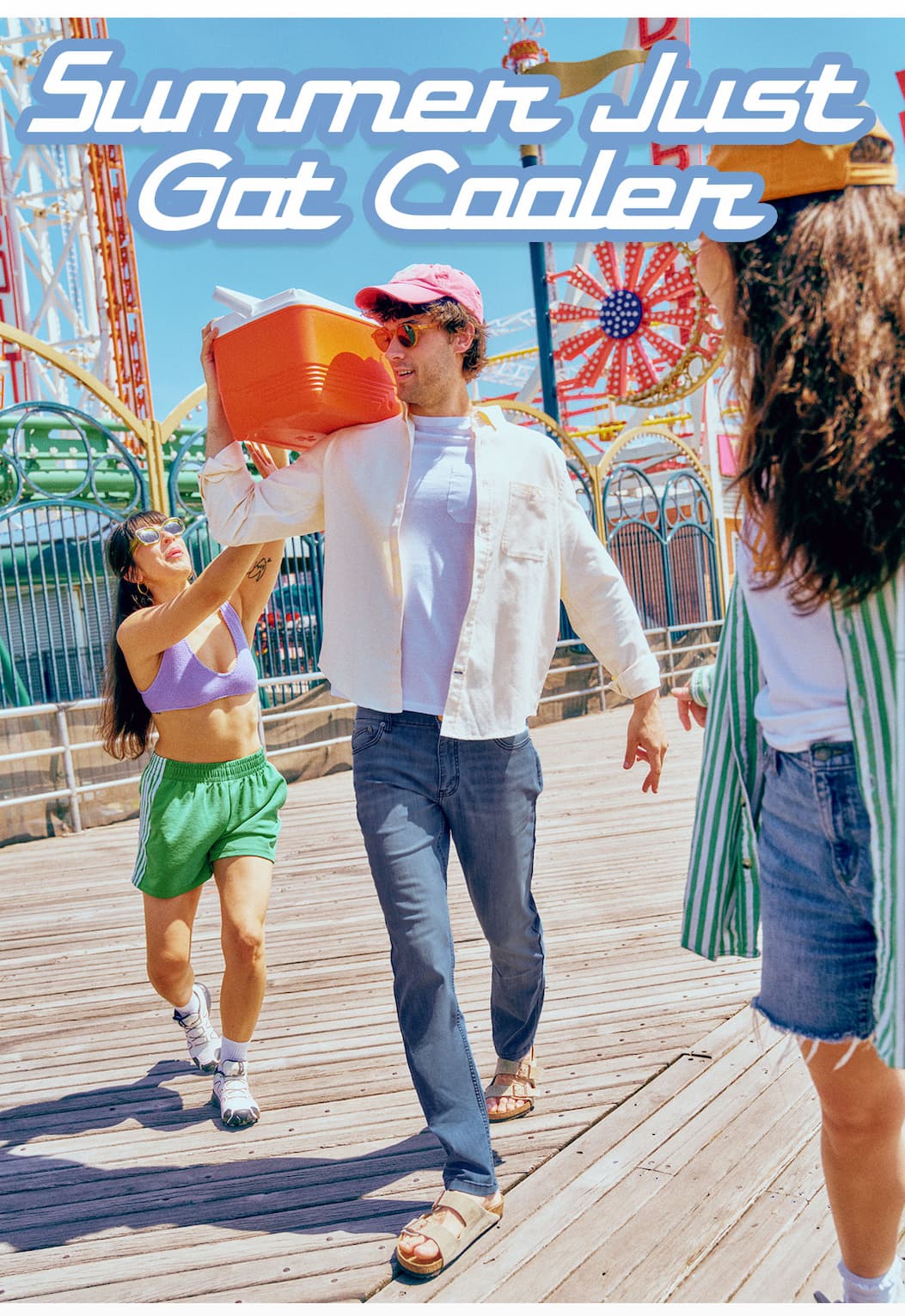 Summer Just Got Cooler. Image of man in jeans on the boardwalk.