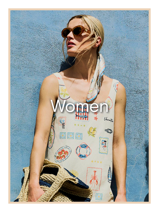 Woman wearing a printed dress with sunglasses.