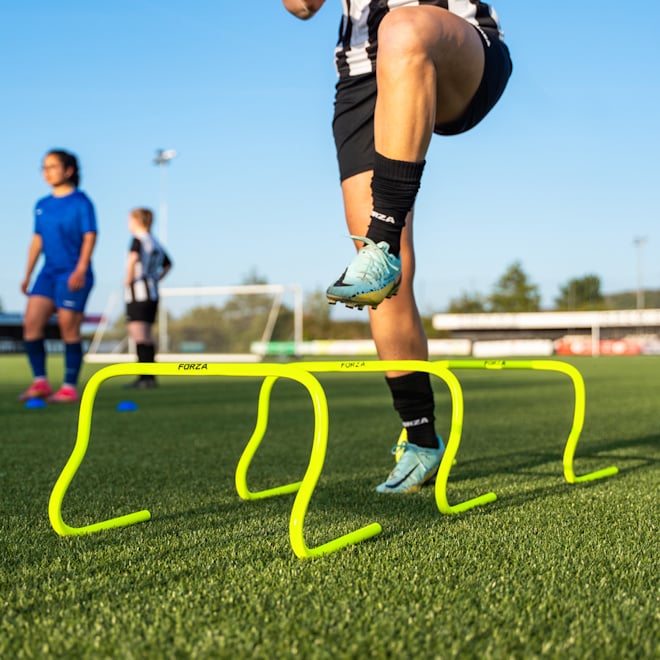 Soccer player training with the FORZA Speed & Agility Ladder.