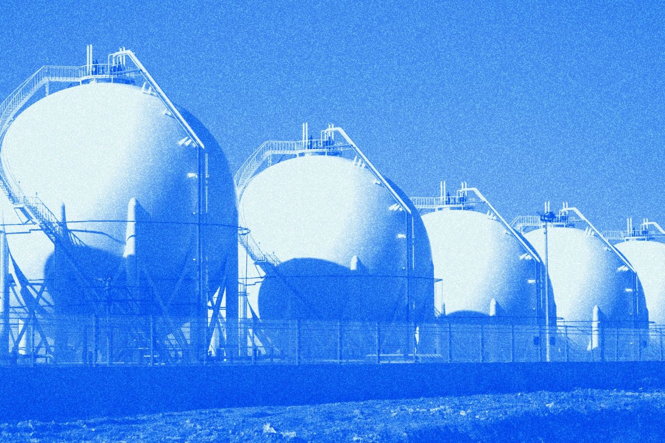 Photo of large natural gas refinery tanks, tinted with Morning Brew blue.
