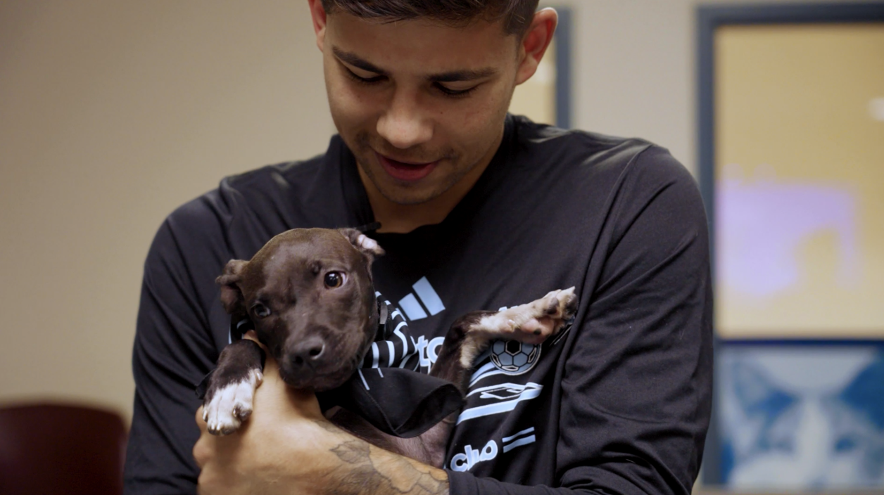 Anthony Markanich with a puppy