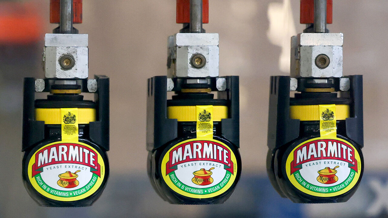 Jars of Marmite on the packaging line inside the Unilever factory