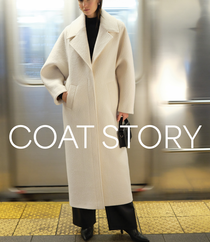 Fred stands on a subway platform wearing The Charlton Coat with the text “Coat Story.”