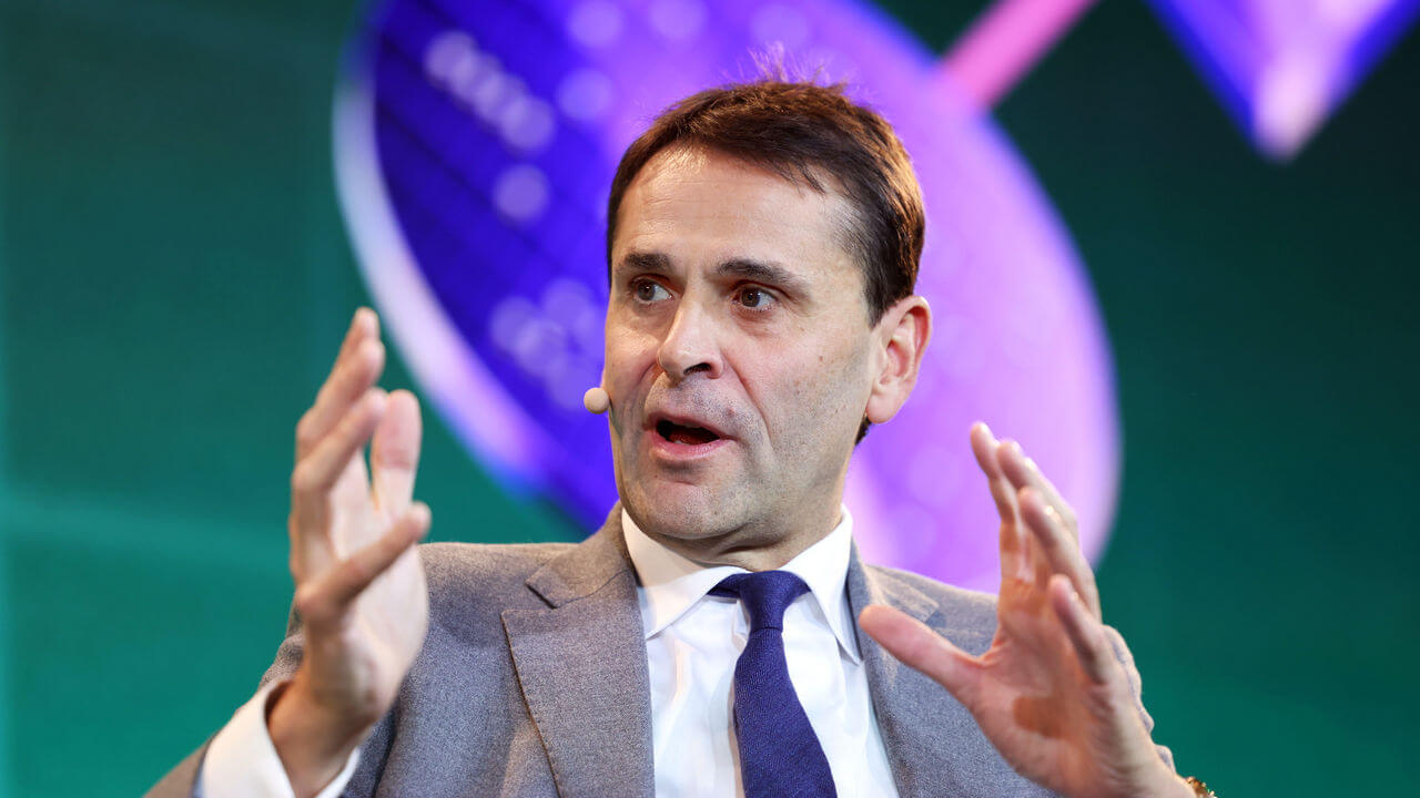 Christophe Fouquet, chief executive officer of ASML, talks at a summit.