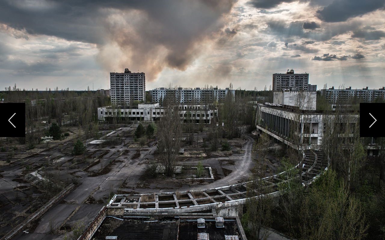  A plume of smoke from a forest fire rises beyond the ghost town of Pripyat, where workers and the families of the Chernobyl nuclear power plant once lived. 