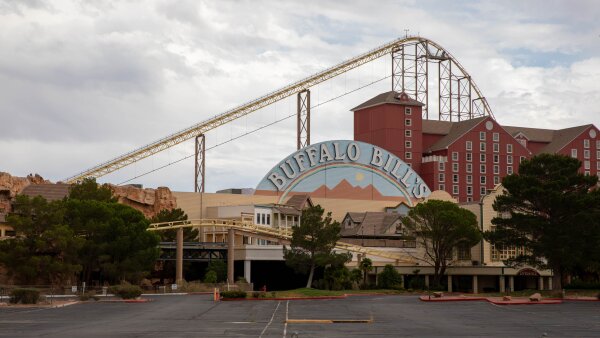 Outside the Buffalo Bill's Casino in Primm, Nev. A rollercoaster is behind the building.