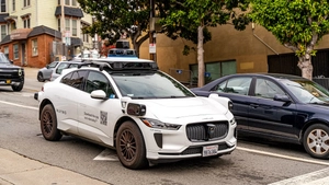 white Waymo vehicle