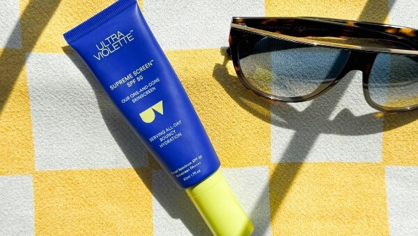 sunscreen against yellow towel