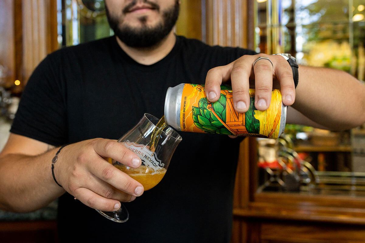 Sierra Nevada bartender pouring a can of Who Run Bartertown? into a glass