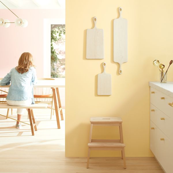 A room with yellow wall paint and decorations.