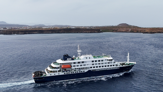 A cruise ship on water from above. 