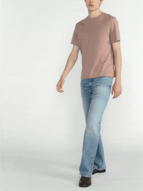 b'The model is wearing The Bootcut Jean in Camping paired with the Light Cotton Tee in Warm Mauve.'