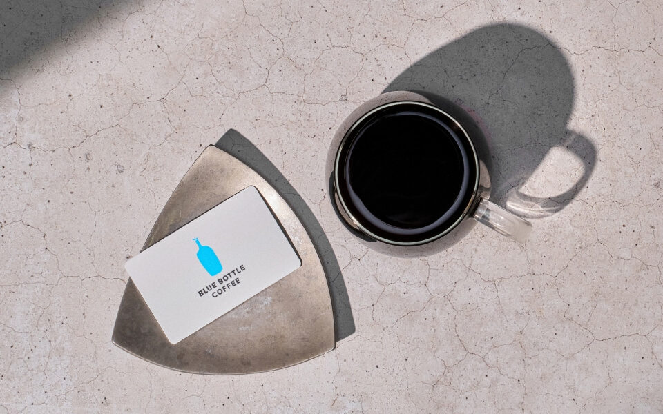 Image of gift card and coffee glass.