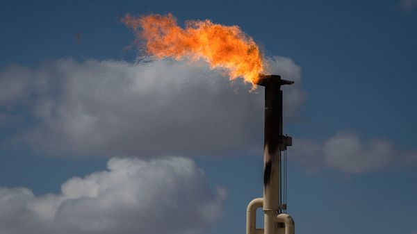 Flares burn off excess natural gas at the Endeavor Energy Resources LP oil and gas wells near Tarzan, Texas, USA.