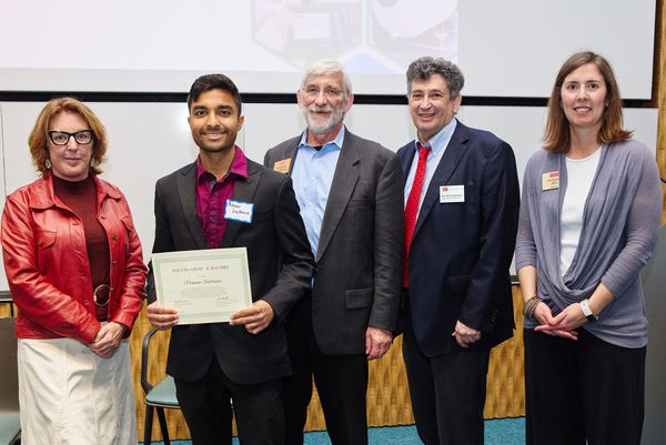 PhD student Pranav Sultania (second from left) accepts the Anthony Janetos Climate Action Prize on behalf of his team from Janetos’ widow Valerie Gamache (far left) and (starting from third from left) BU’s Dennis Carlberg, Michael Gevelber, and Lisa Tornatore. Photo by Dave
Green 