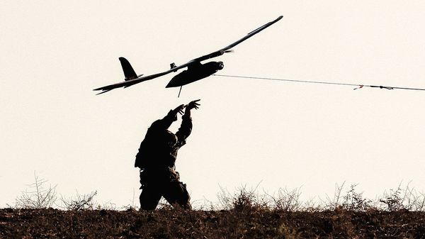 Silhouette of an Israeli army soldier launching unmanned aerial vehicle.