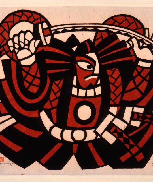 Red and black stencil print of a samurai. 