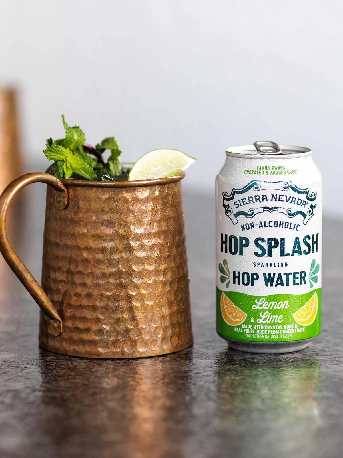 A copper mug and a can of Hop Splash Lemon & Lime