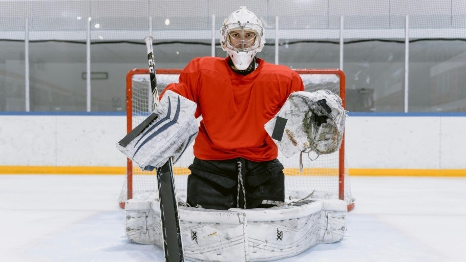 Adult Goalie Player in net