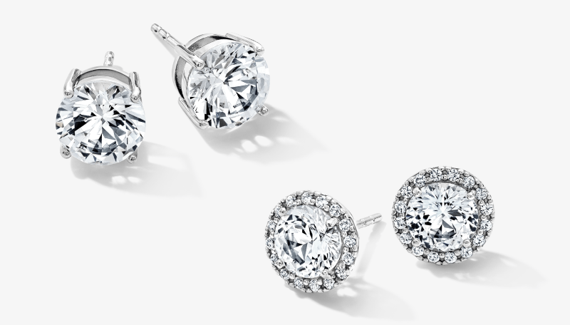 White gold diamond stud earrings in solitaire and halo designs.